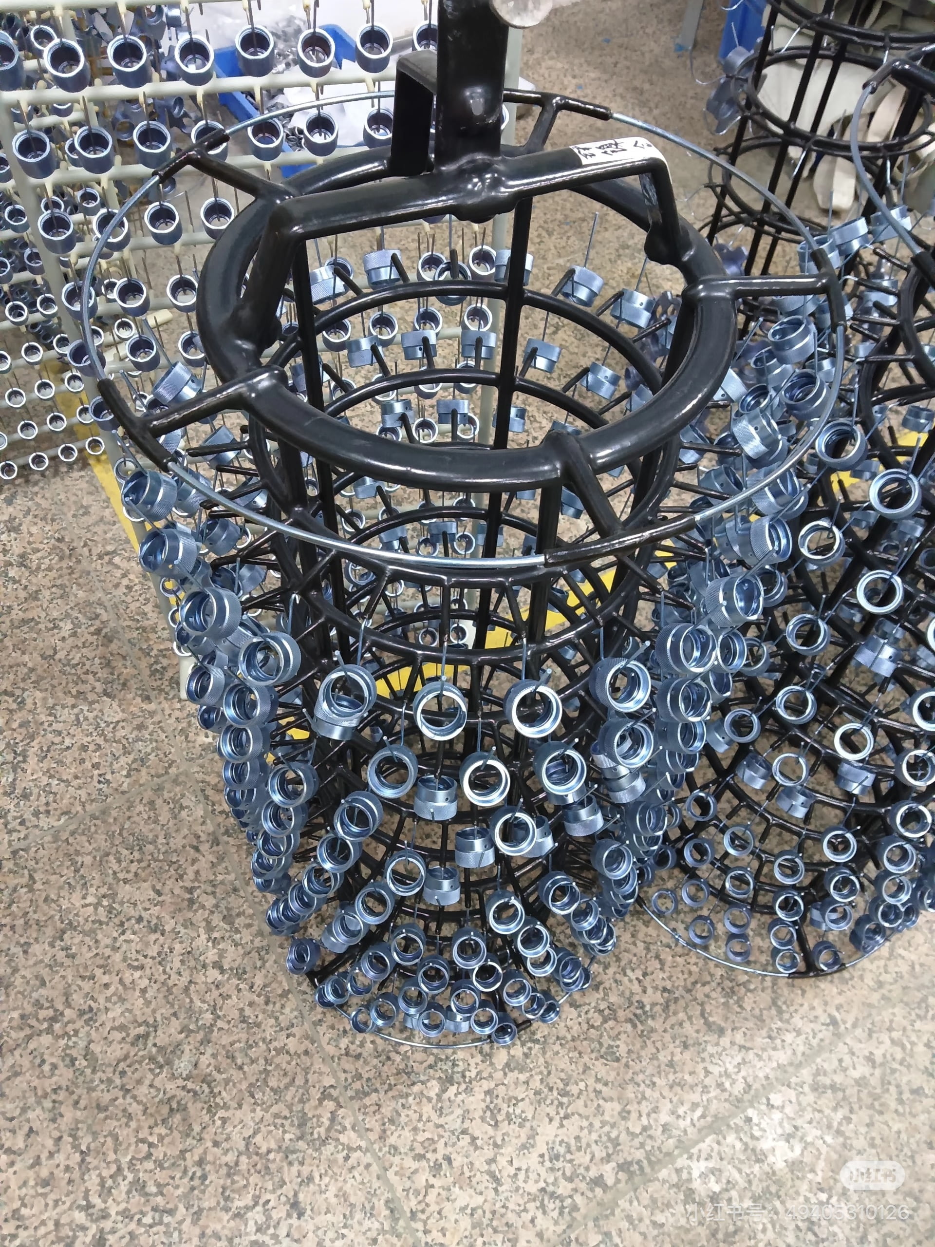 Zinc nickel alloy plated parts on production rack for OEM metal components
