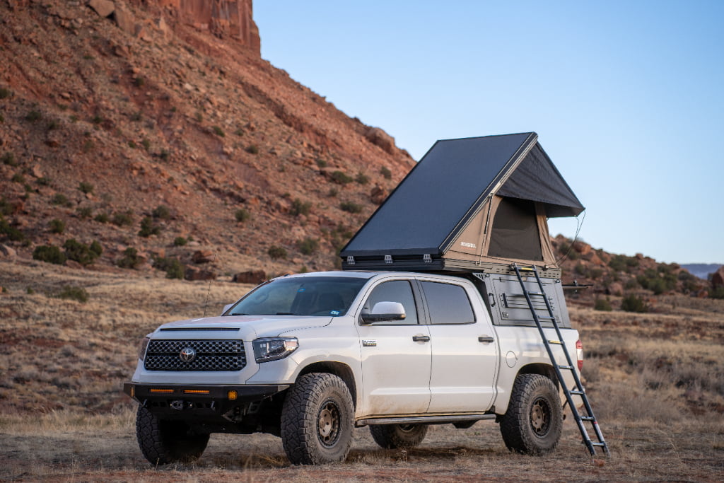 Vehicle accessory application showing welded metal bracket and assembly fit requirements