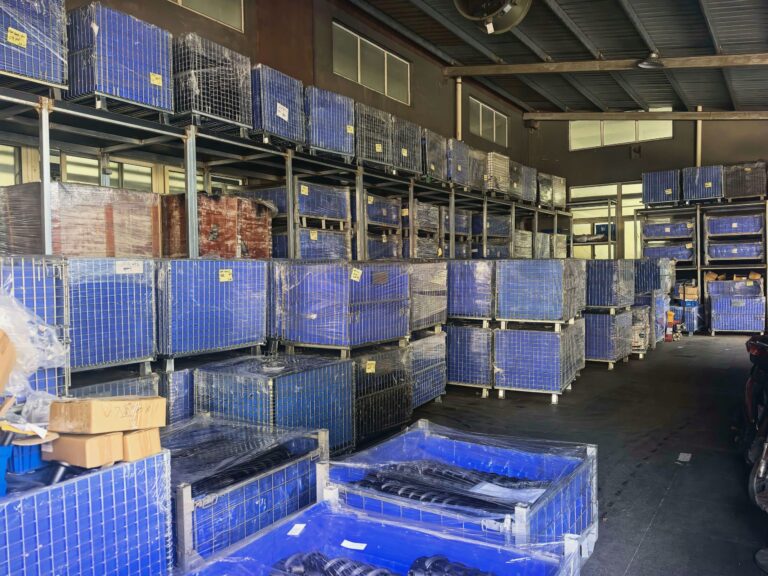 Blue component bins stored on racks in the NBFEIYU finished goods warehouse