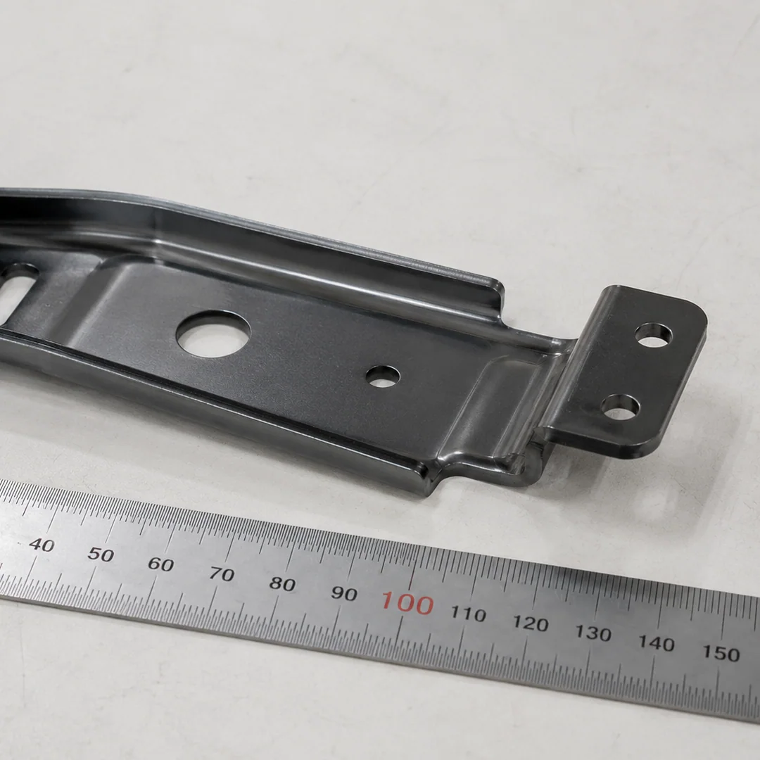 Stamped and formed steel bracket with scale reference at NBFEIYU
